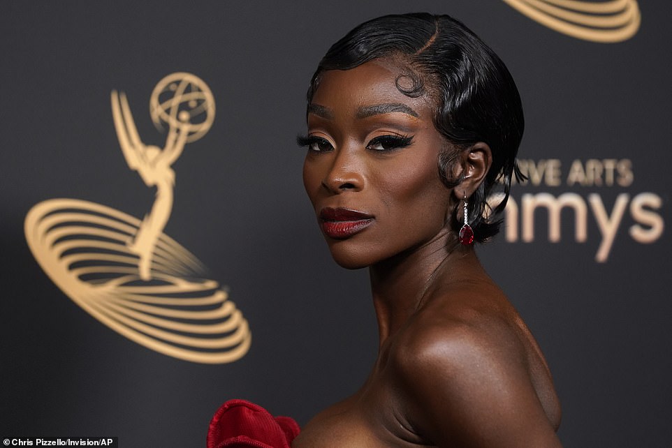 Sparkling beauty: Chelsea wore a pair of sheer mesh opera gloves, and completed the look with a pair of matching sapphire earrings with a touch of deep crimson lipstick.