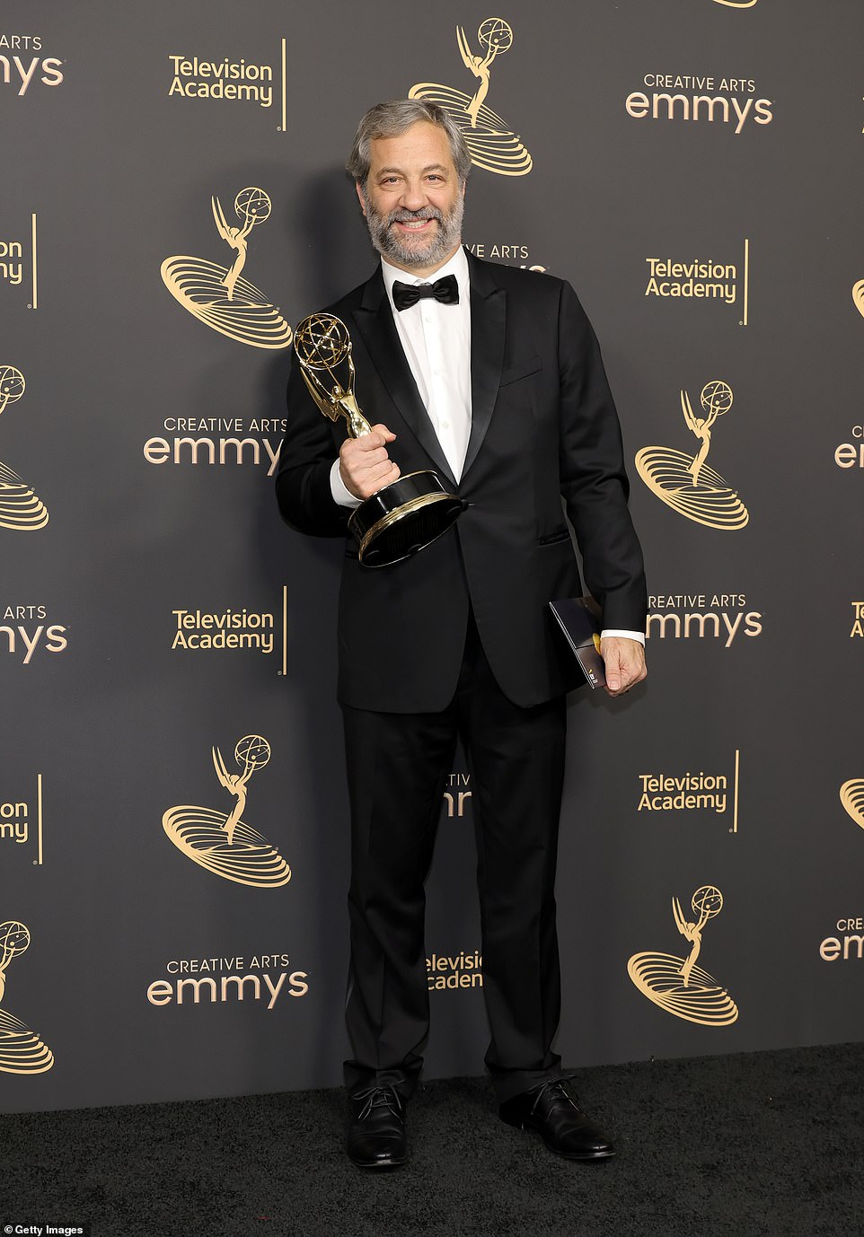Showbiz titan: Judd Apatow proudly raised his Emmy Award for producing and directing a documentary about the late legendary comedian George Carlin