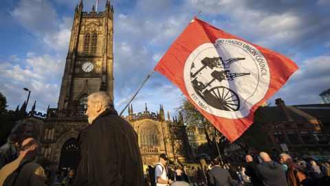 A man holding a union flag awaits the start of the campaign campaign that ran out of stock