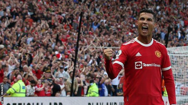 Cristiano Ronaldo celebrates after scoring a goal upon his return to Manchester United