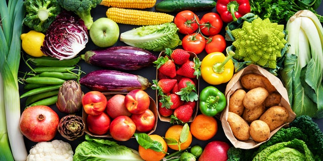 Variety of fresh and healthy organic fruits and vegetables on the table.