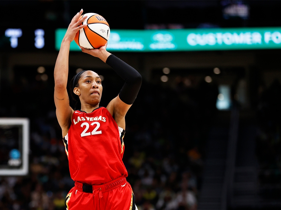 Aja Wilson hits the ball in a game against Seattle
