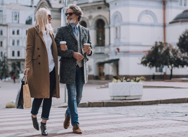 Mature modern couple living in a walkable city, one of the healthy habits to live up to 100